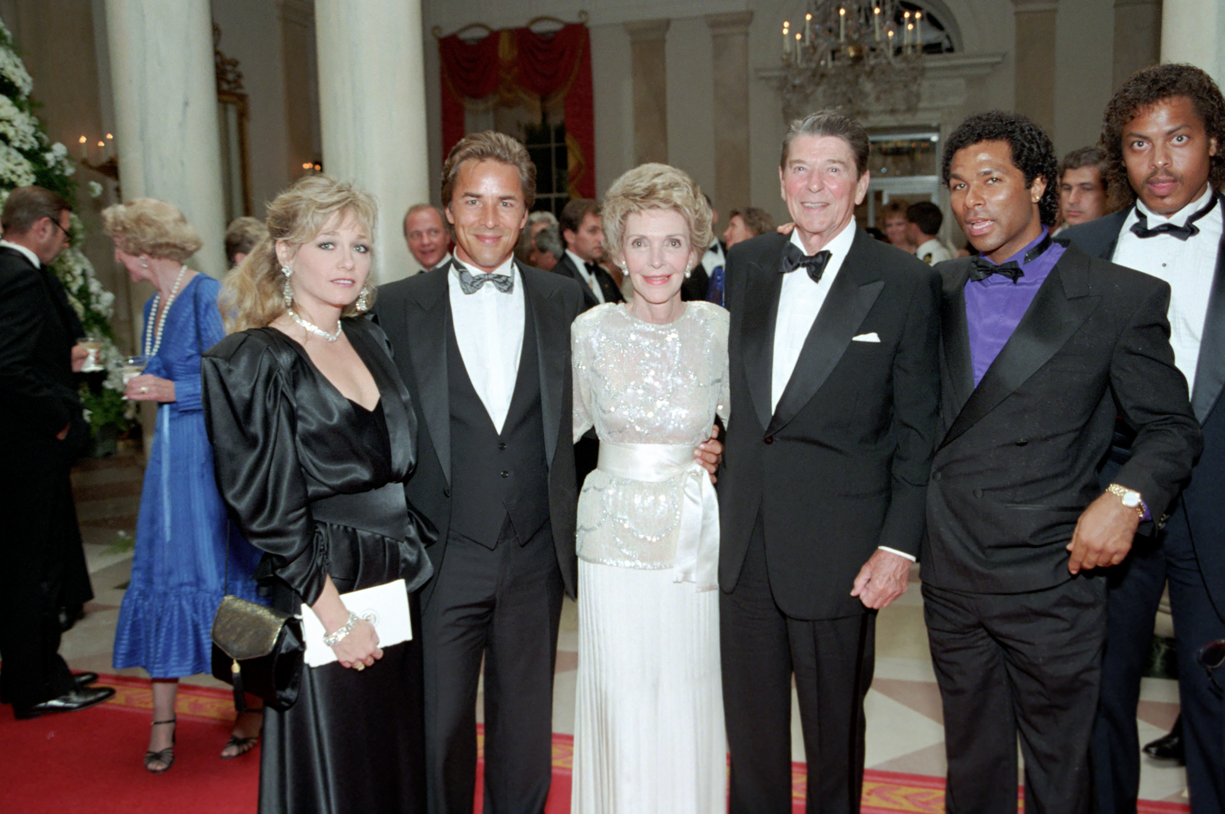 Don Johnson and Philip Michael Thomas of Miami Vice at a 1985 White House state dinner, real photograph.