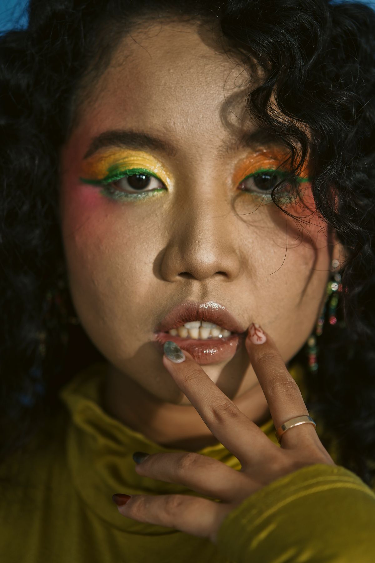 Bright, playful pop-glam face with layered saturated eye color