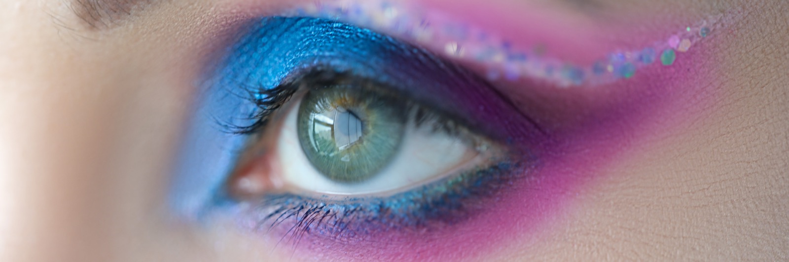 A bold saturated blue eye with sparkle — the 1985 saturated lid