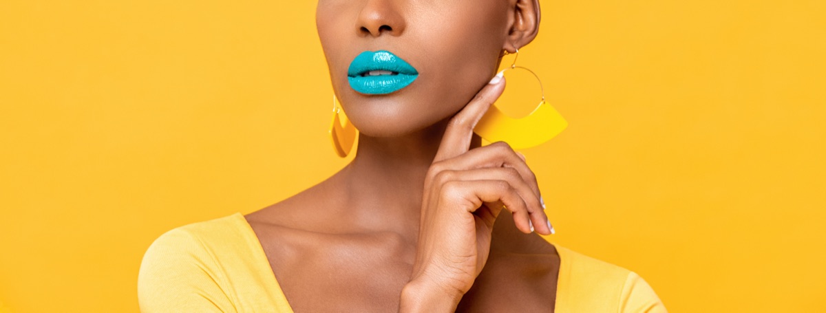 A bold, saturated statement lip — the deliberate 1985 mouth