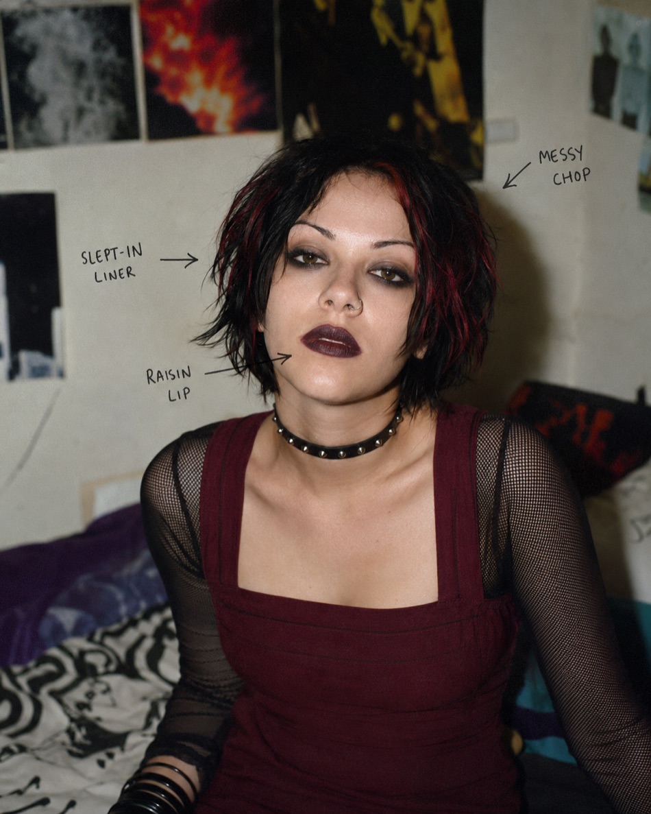 An alternative-edge 1999 look: deep raisin lip, smudged liner, choppy dark hair