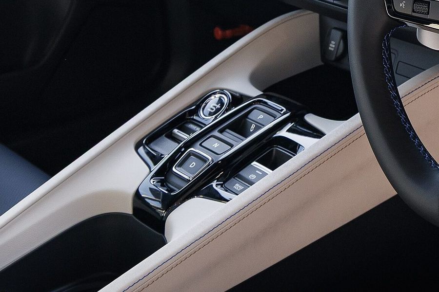 Detail crop of the Prelude push-button shifter console.