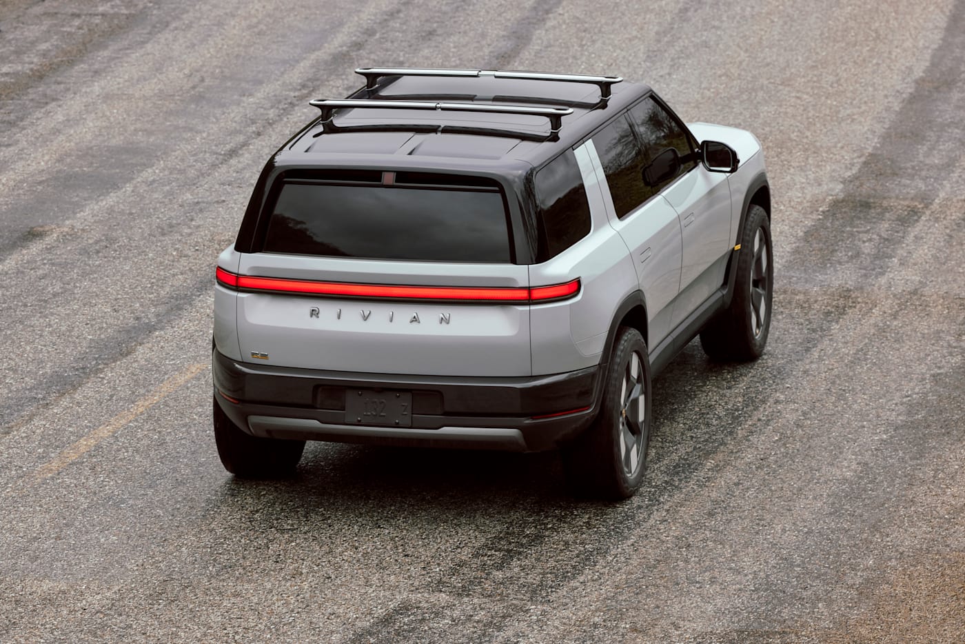 Rivian R2 electric SUV, rear three-quarter, official press photograph.