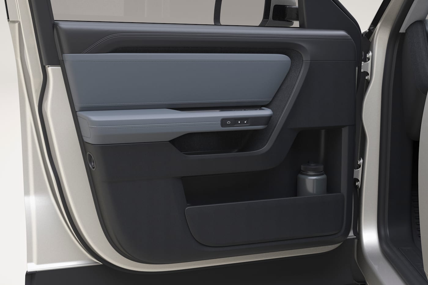 Rivian R2 interior door panel detail, official press photograph.