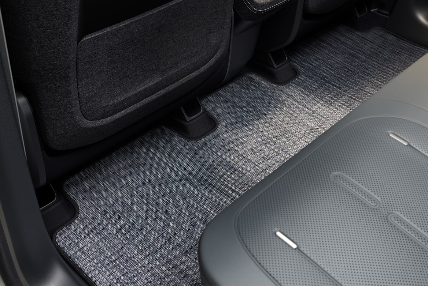 Rivian R2 footwell material detail, official press photograph.