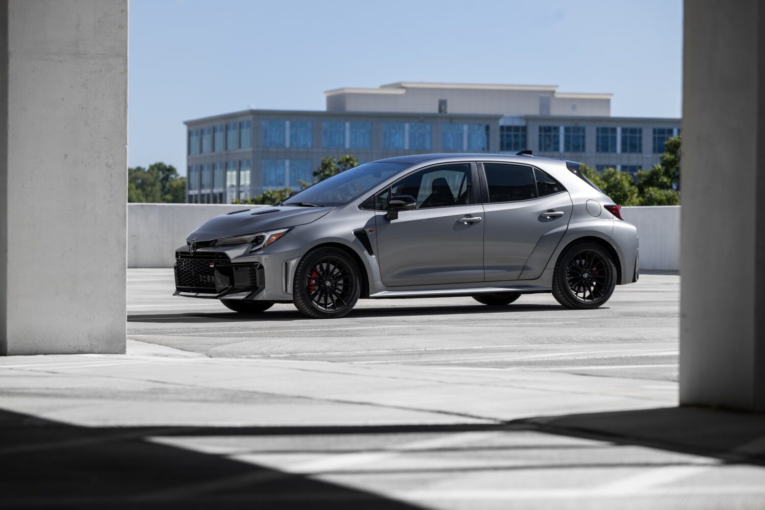2026 Toyota GR Corolla Premium Plus in Heavy Metal, studio side profile.