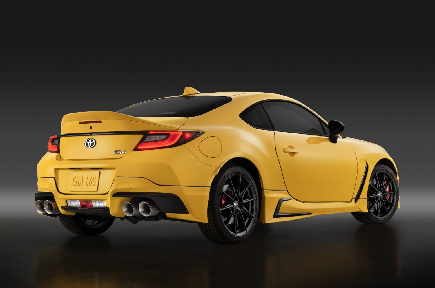 2026 Toyota GR86 Yuzu Edition, studio rear three-quarter view.