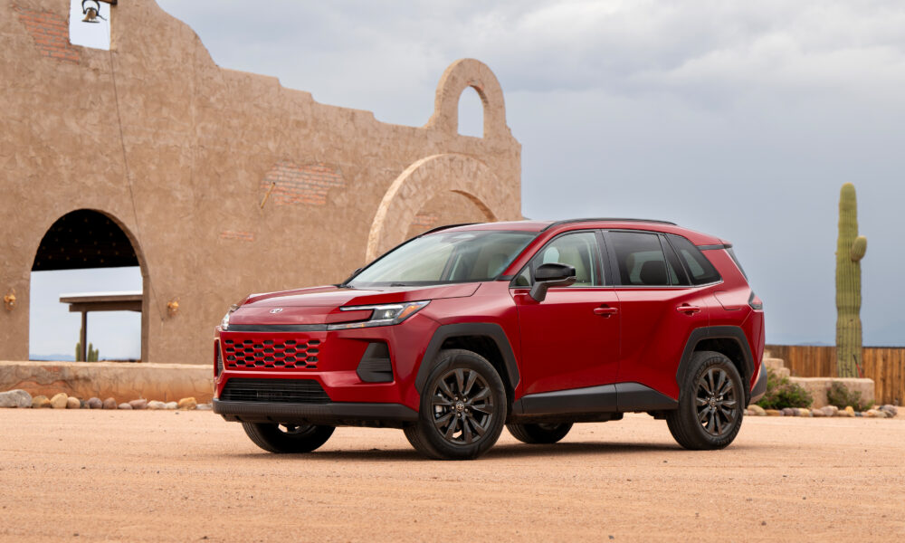 2026 Toyota RAV4 Hybrid XLE Premium in Ruby Flare Pearl, official press photograph.