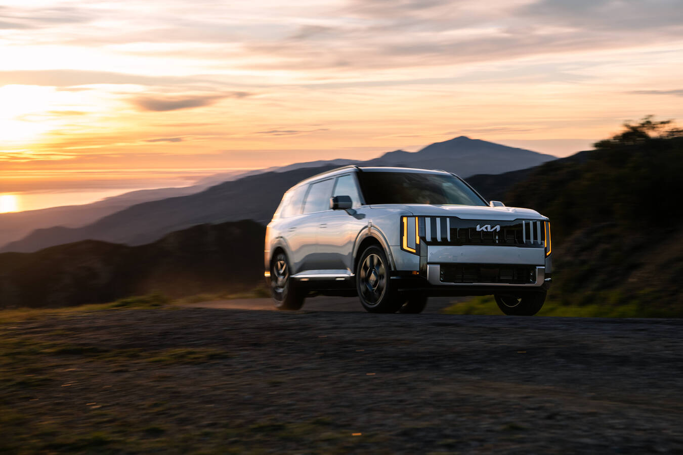 2027 Kia Telluride Hybrid SXP driving shot, official Kia press photography, 6 of 8.