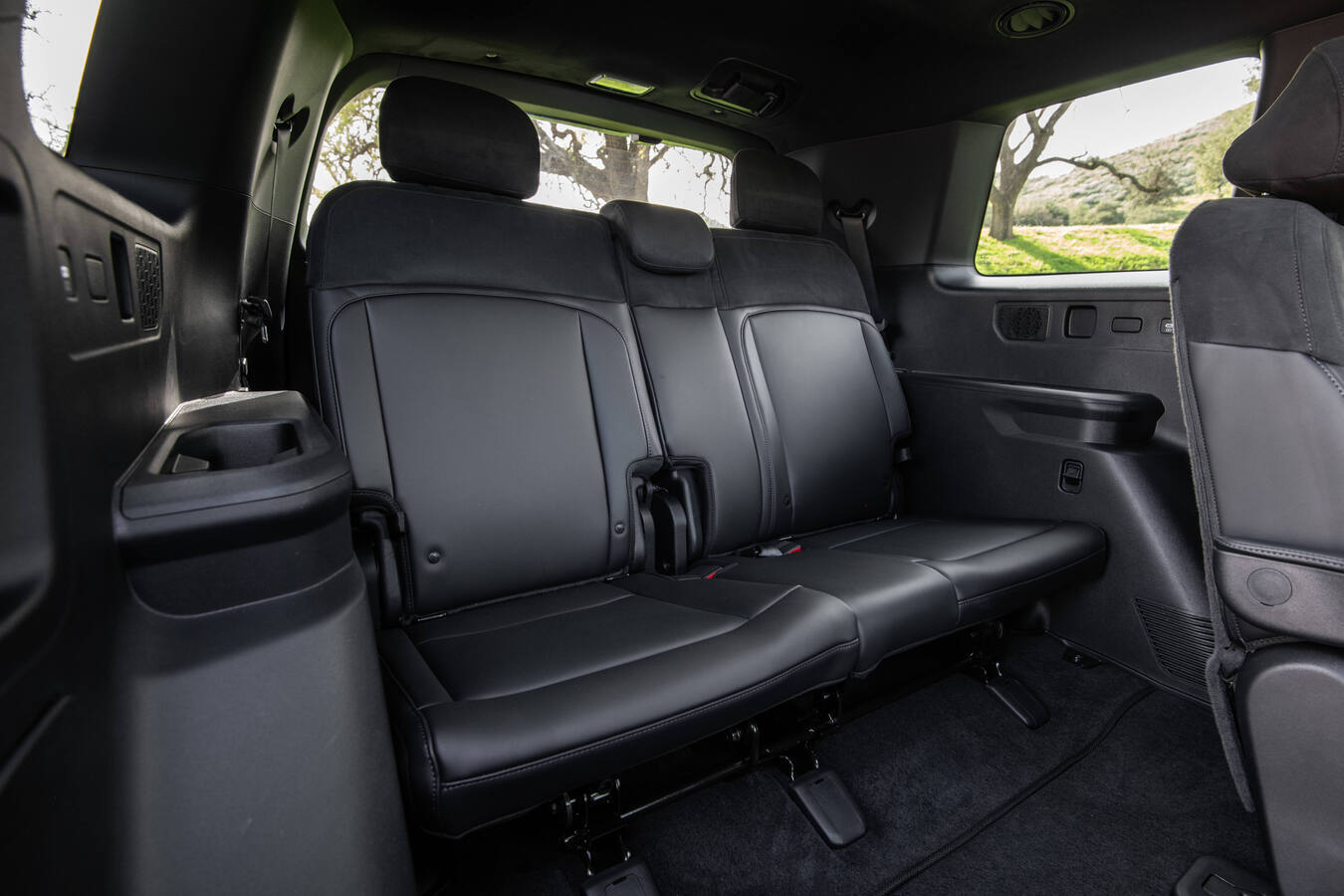 2027 Kia Telluride third-row bench seat, black leather upholstery, official Kia press photography.
