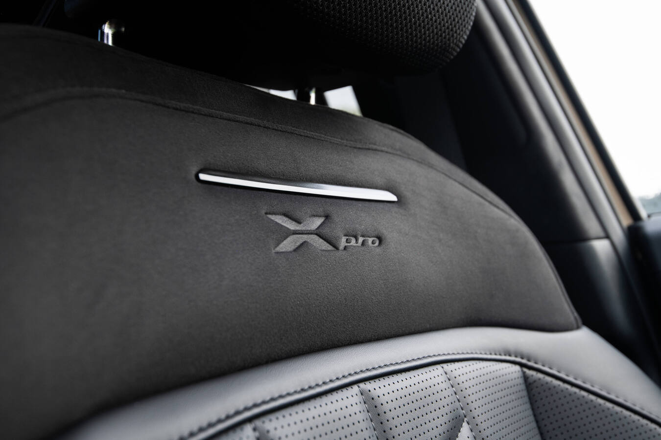 2027 Kia Telluride X-Pro front seat detail showing embossed X-Pro logo, official Kia press photography.