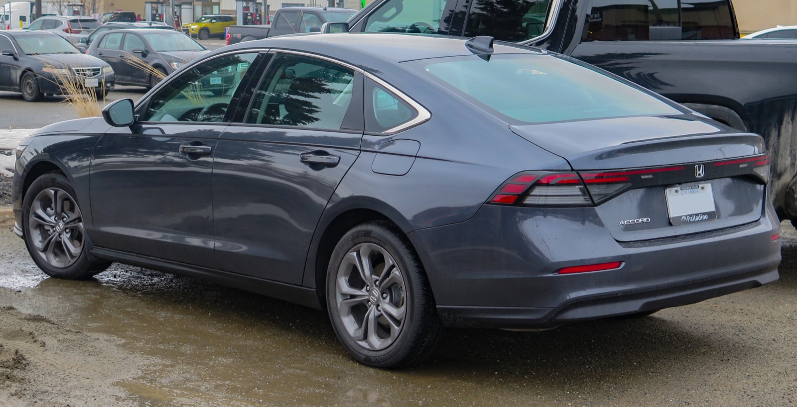 2027 Honda Accord EX, rear three-quarter view, real photograph.
