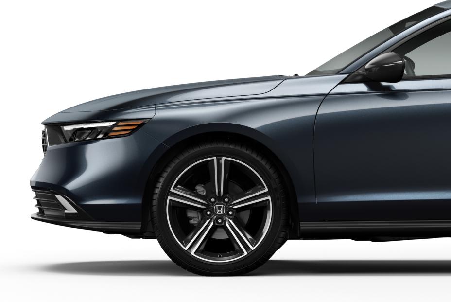 2027 Honda Accord SE, close-up detail of the front fascia and 19-inch wheel, official Honda press photograph.