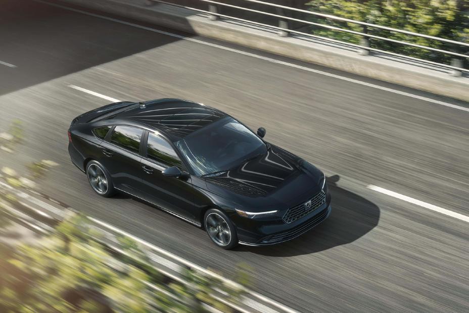 2027 Honda Accord SE, elevated front three-quarter, official Honda press photograph.