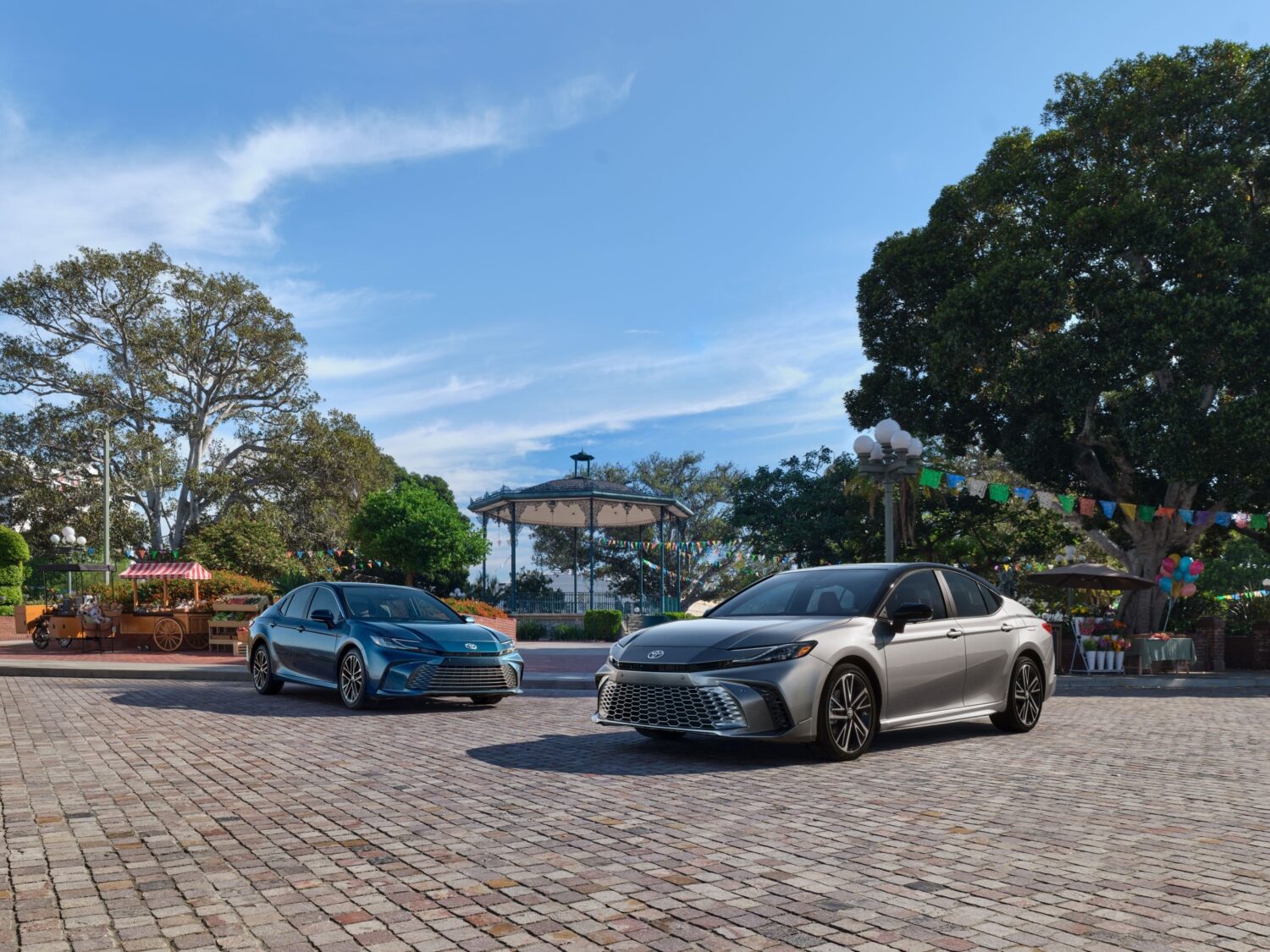 2027 Toyota Camry lineup group shot, official Toyota press photograph.