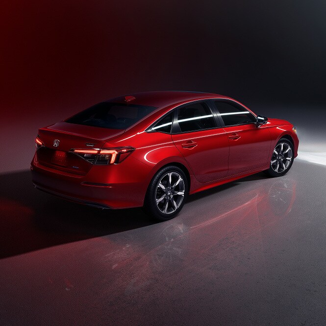 2026 Honda Civic Sedan, rear three-quarter studio, official Honda press photograph