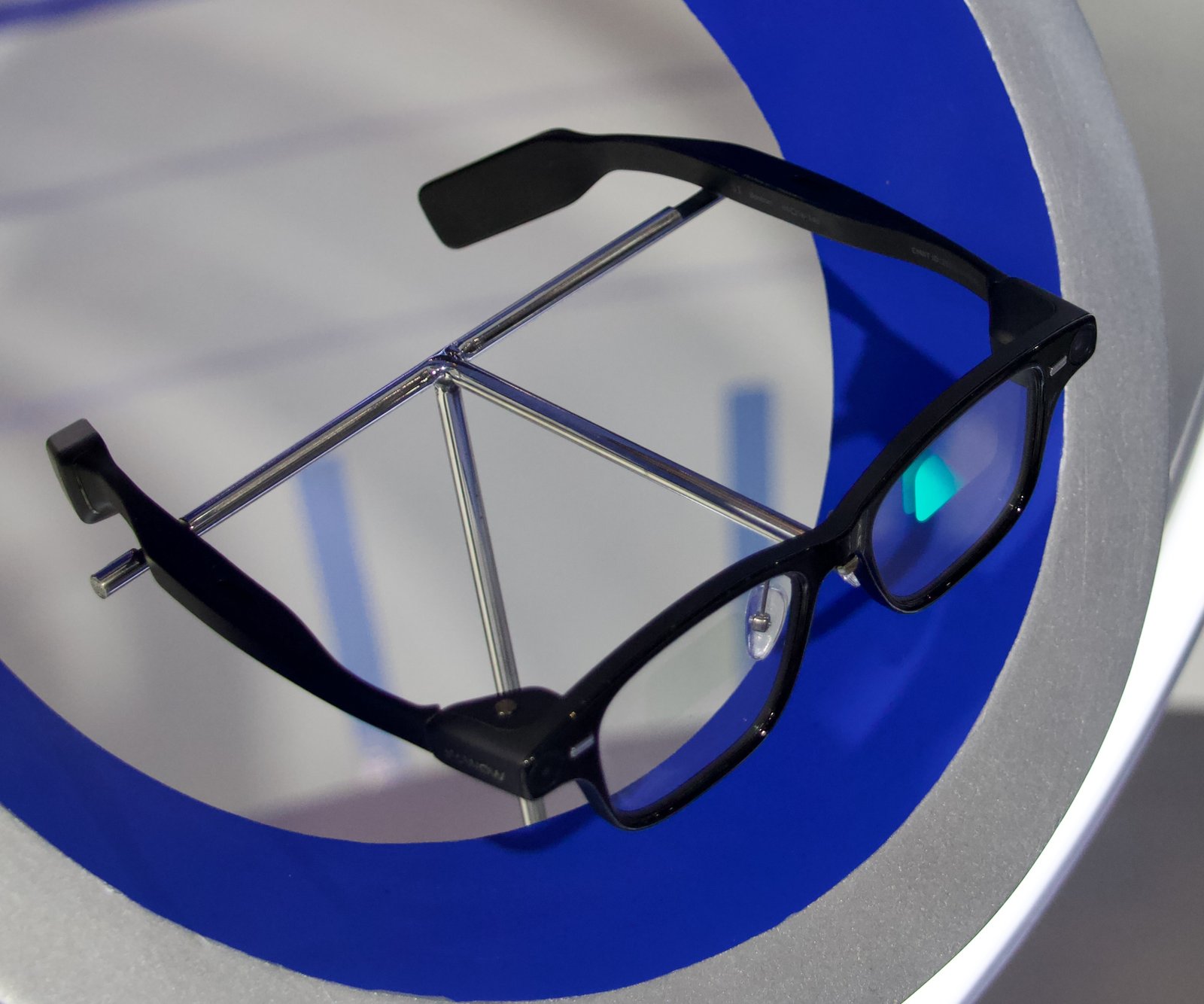 A pair of AI smart glasses with an in-lens display, real photograph.