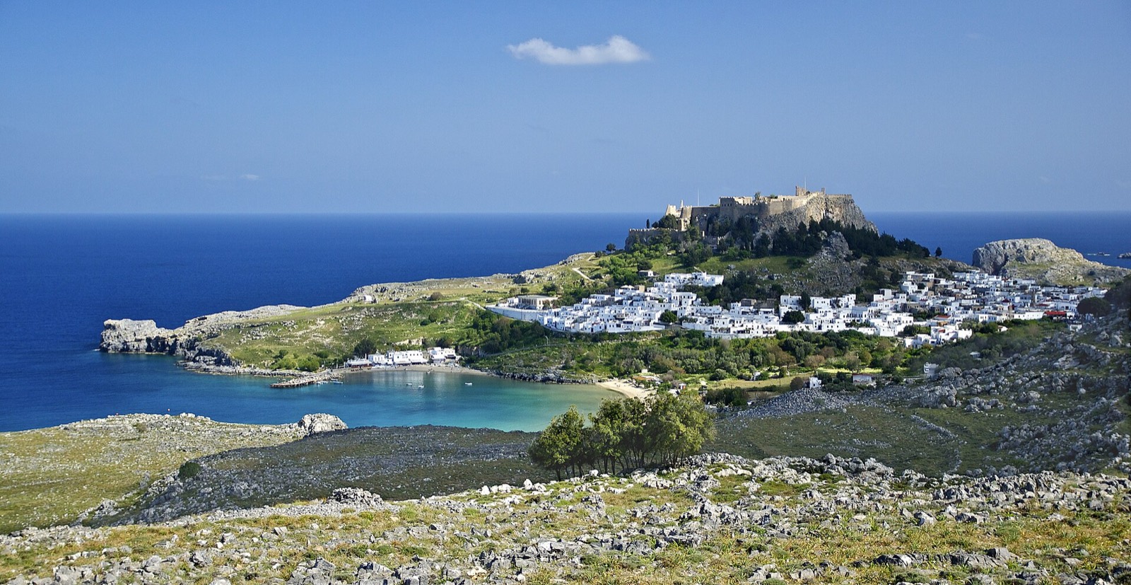 Whitewashed village of Lindos on Rhodes with the acropolis above