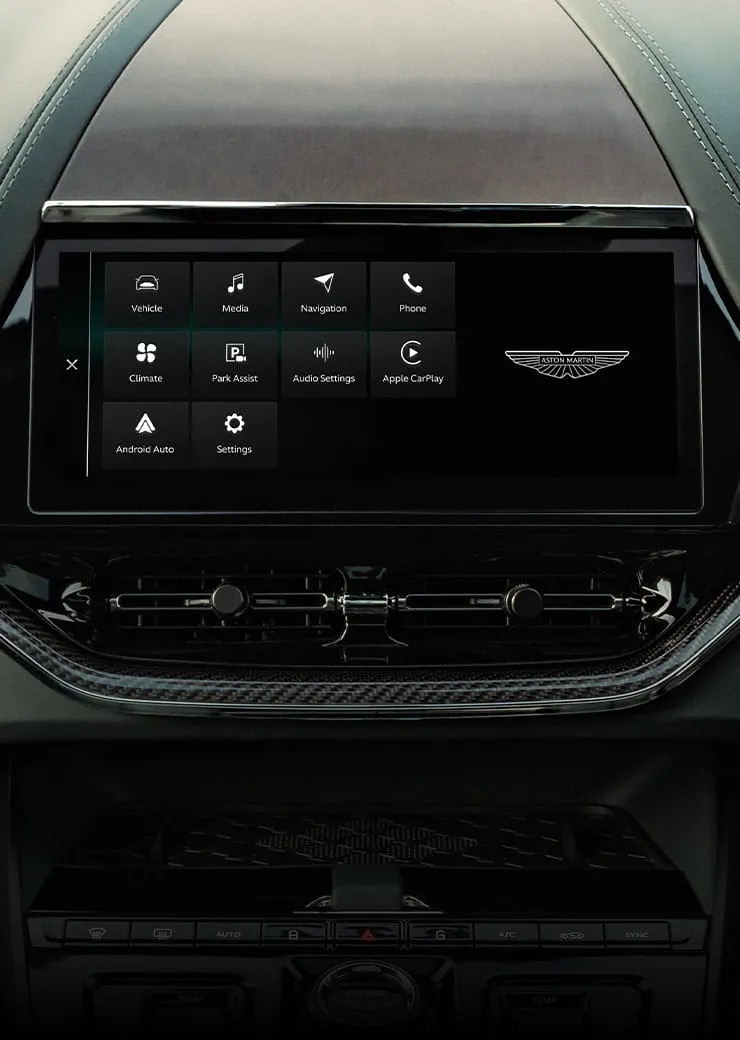 Aston Martin DBX707 infotainment screen showing the app menu with Apple CarPlay and Android Auto.