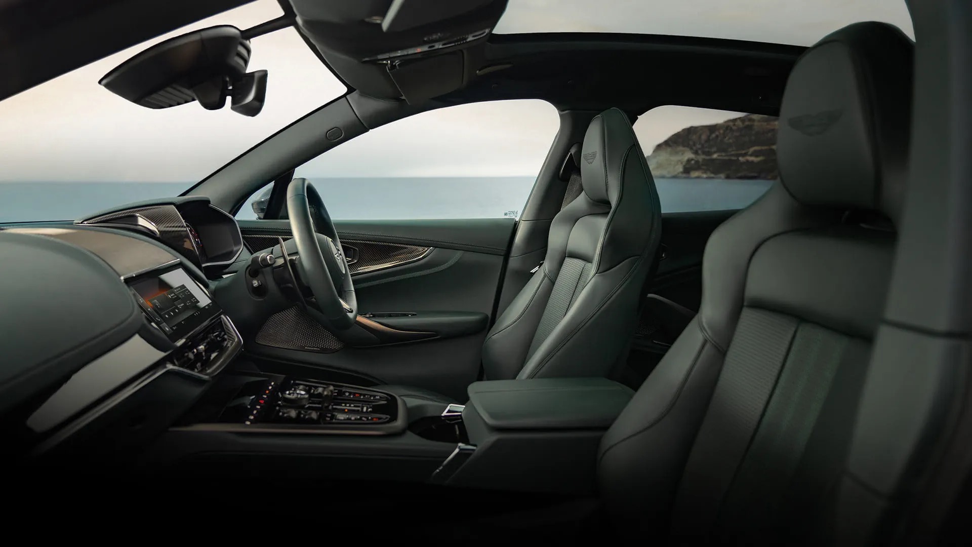 Interior of the Aston Martin DBX707, showing the cockpit and front seats.