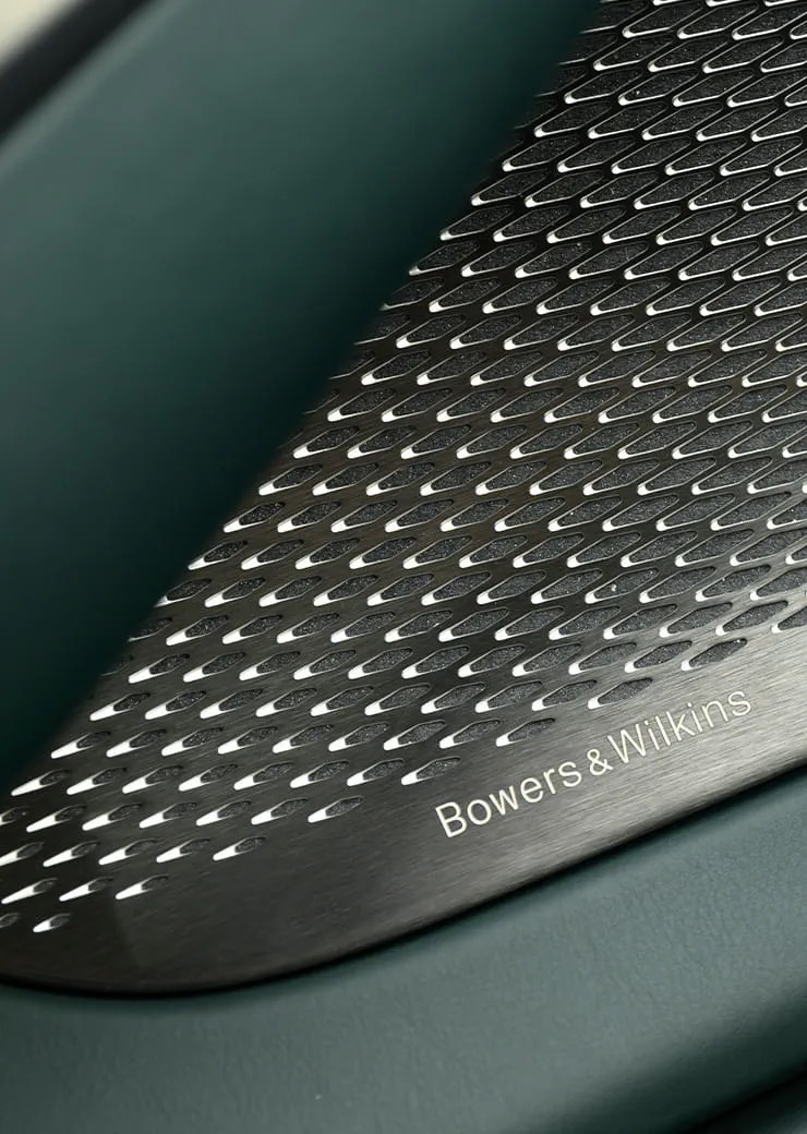 Detail of the Aston Martin DBX707's audio system speaker grille.