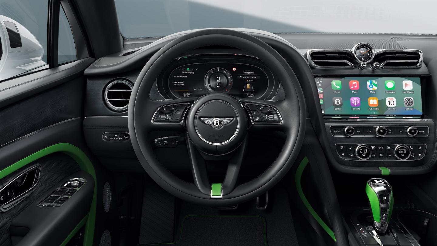 Bentley Bentayga cockpit, showing the steering wheel and center touchscreen.