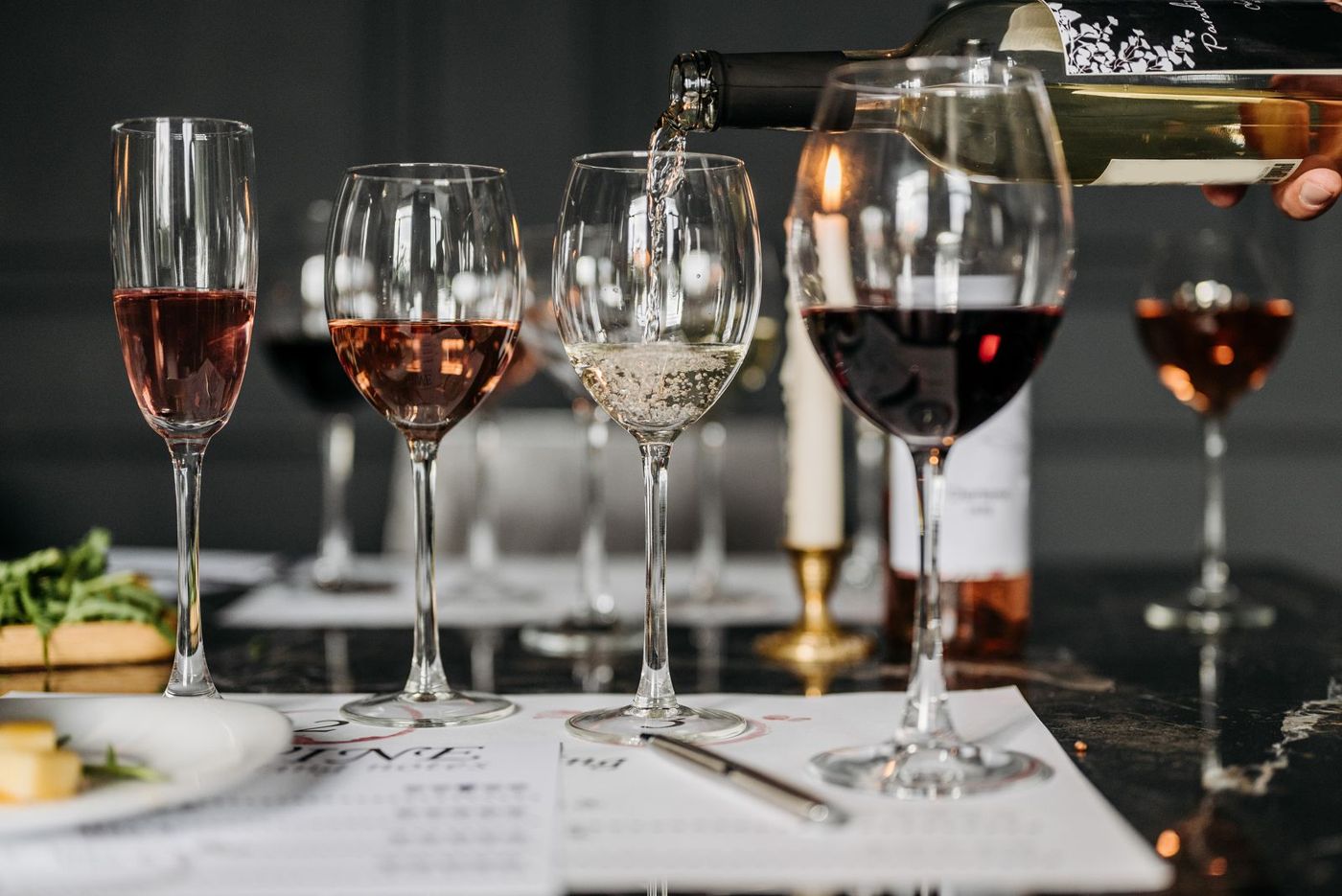 Several wine glasses on a table set for a tasting