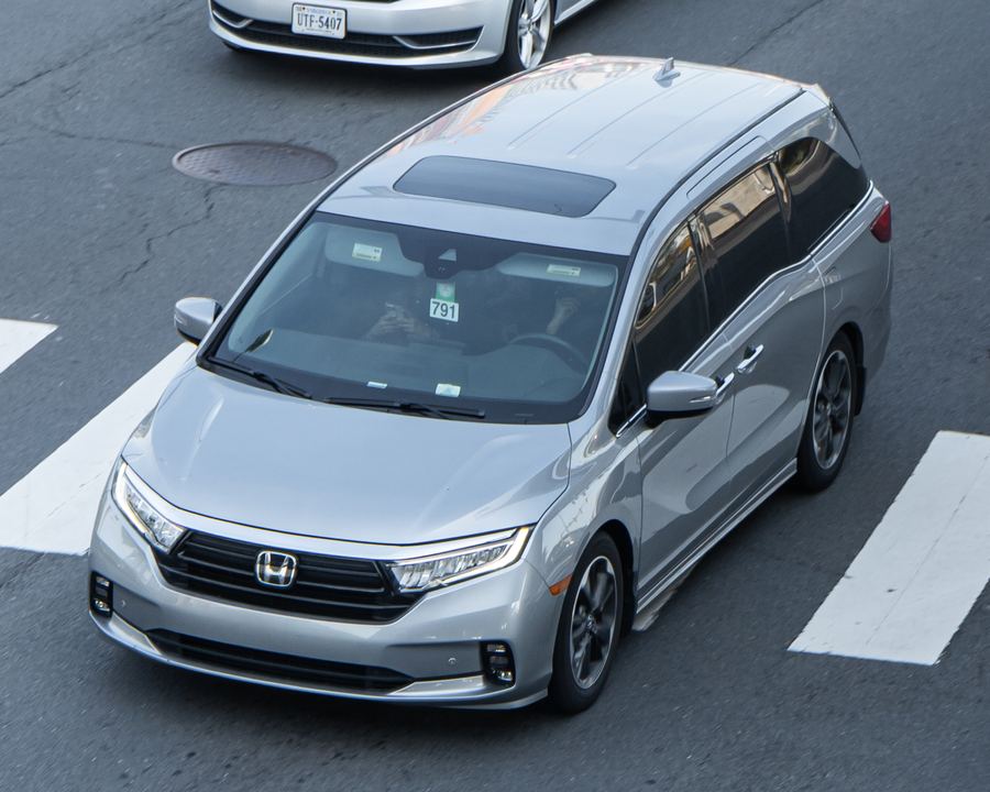 Honda Odyssey in silver, seen from above and in front.