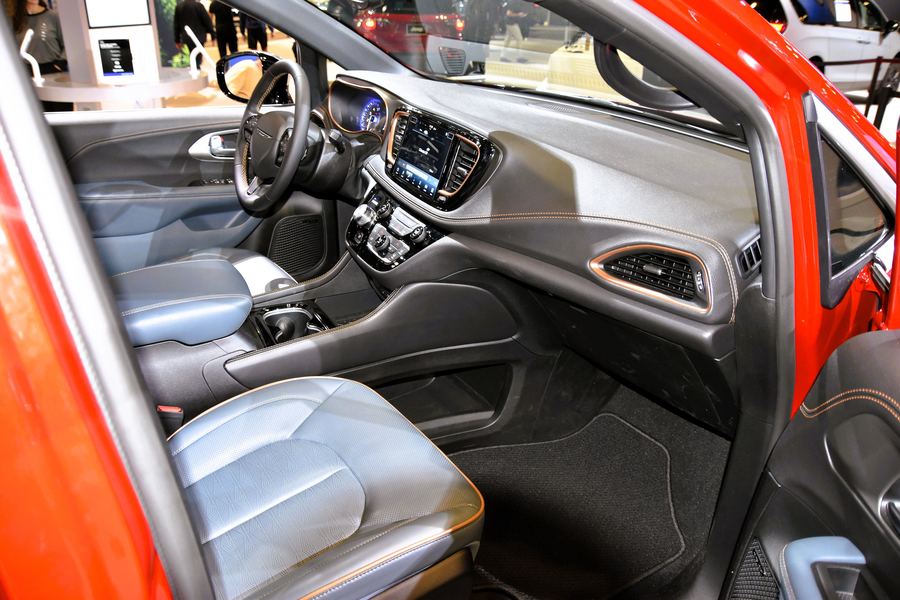 Pacifica Pinnacle AWD (2026) cockpit and front seats seen through the open door.