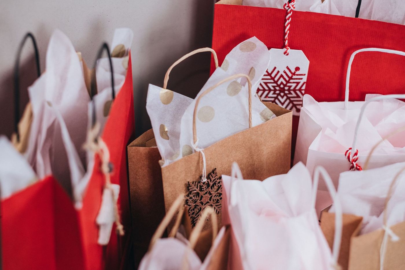 Shopping bags full of wrapped holiday purchases