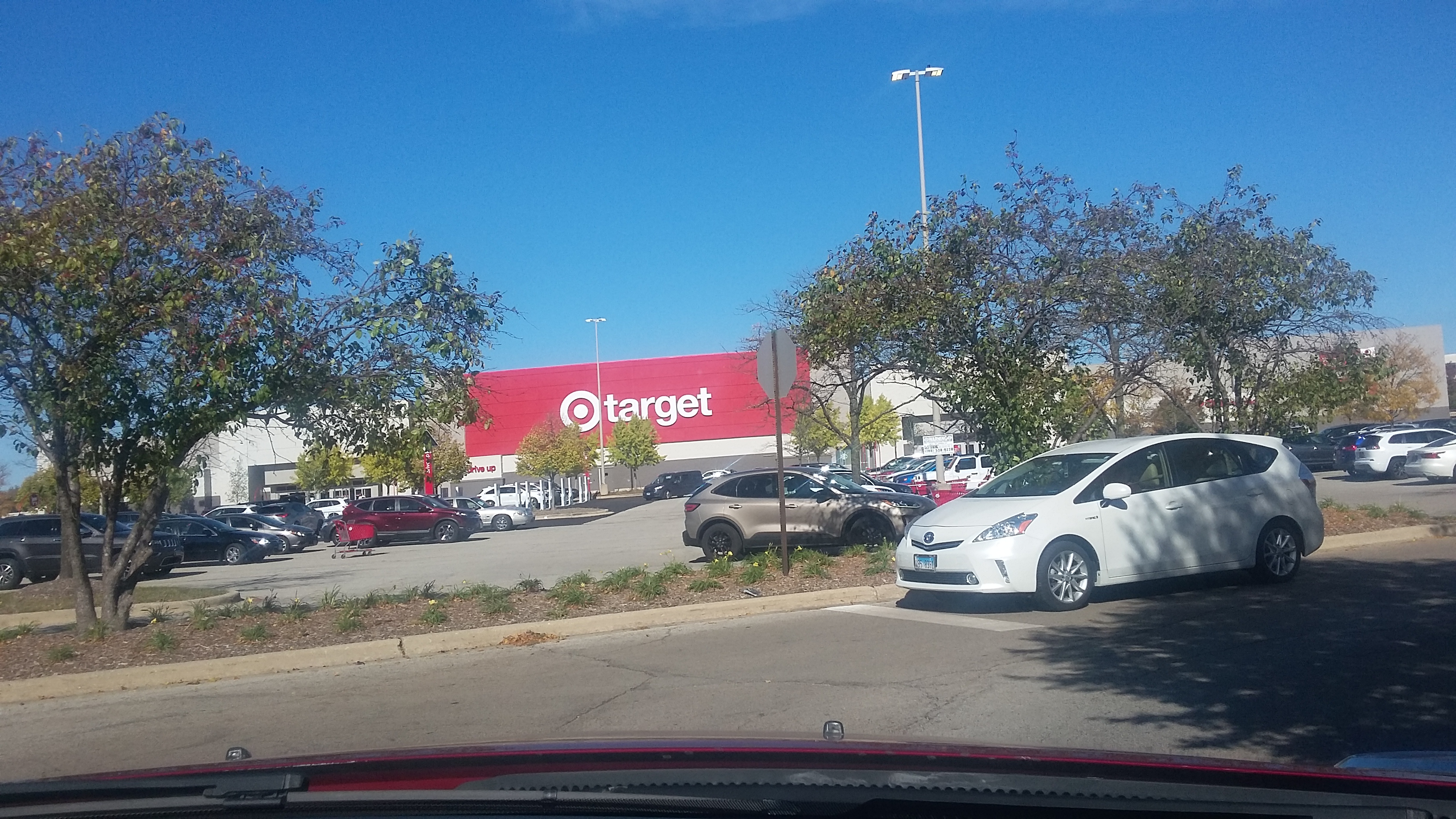 A Target storefront and parking lot on a clear day, real photograph.