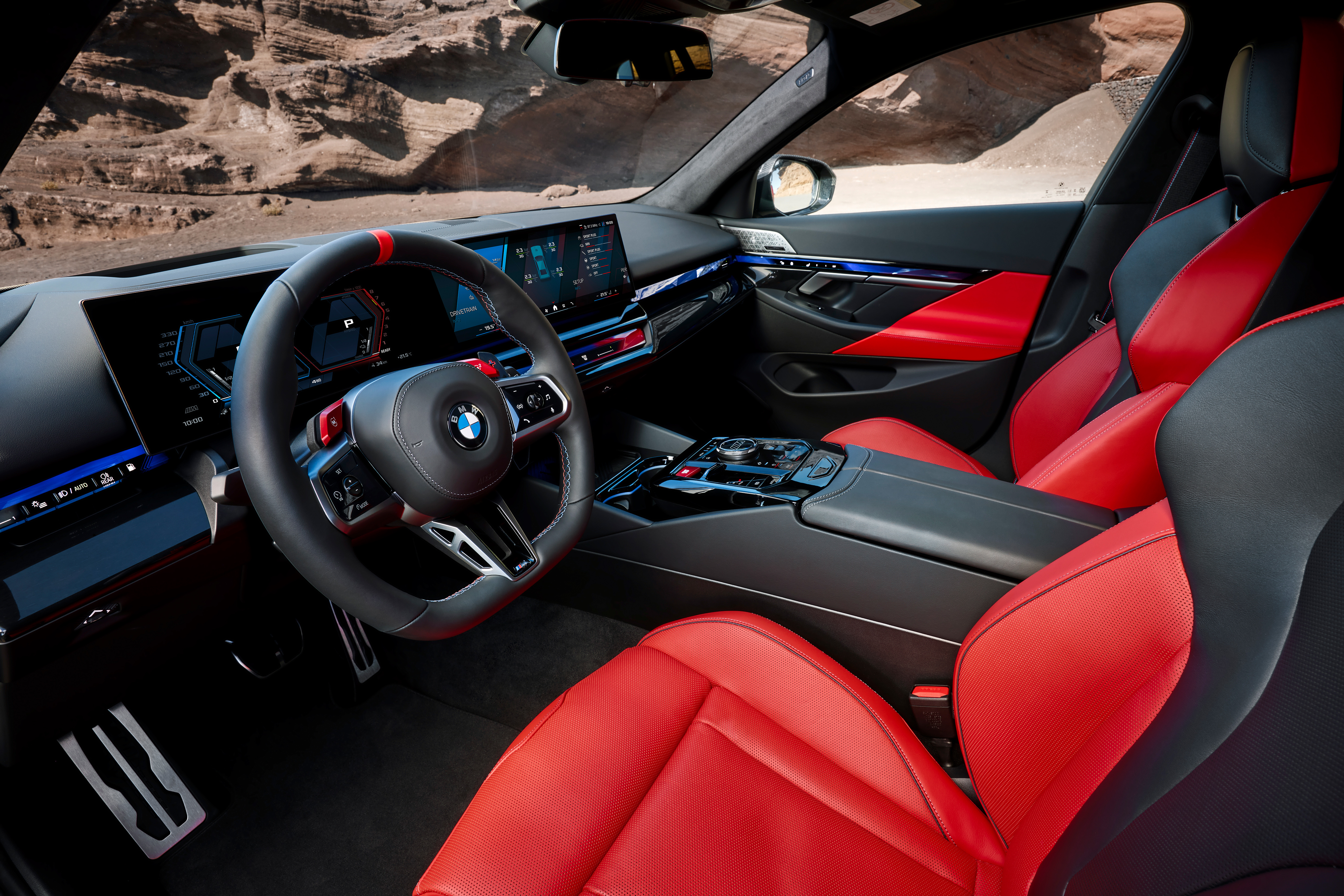 Interior of the 2027 BMW M5, showing the cockpit and M steering wheel.