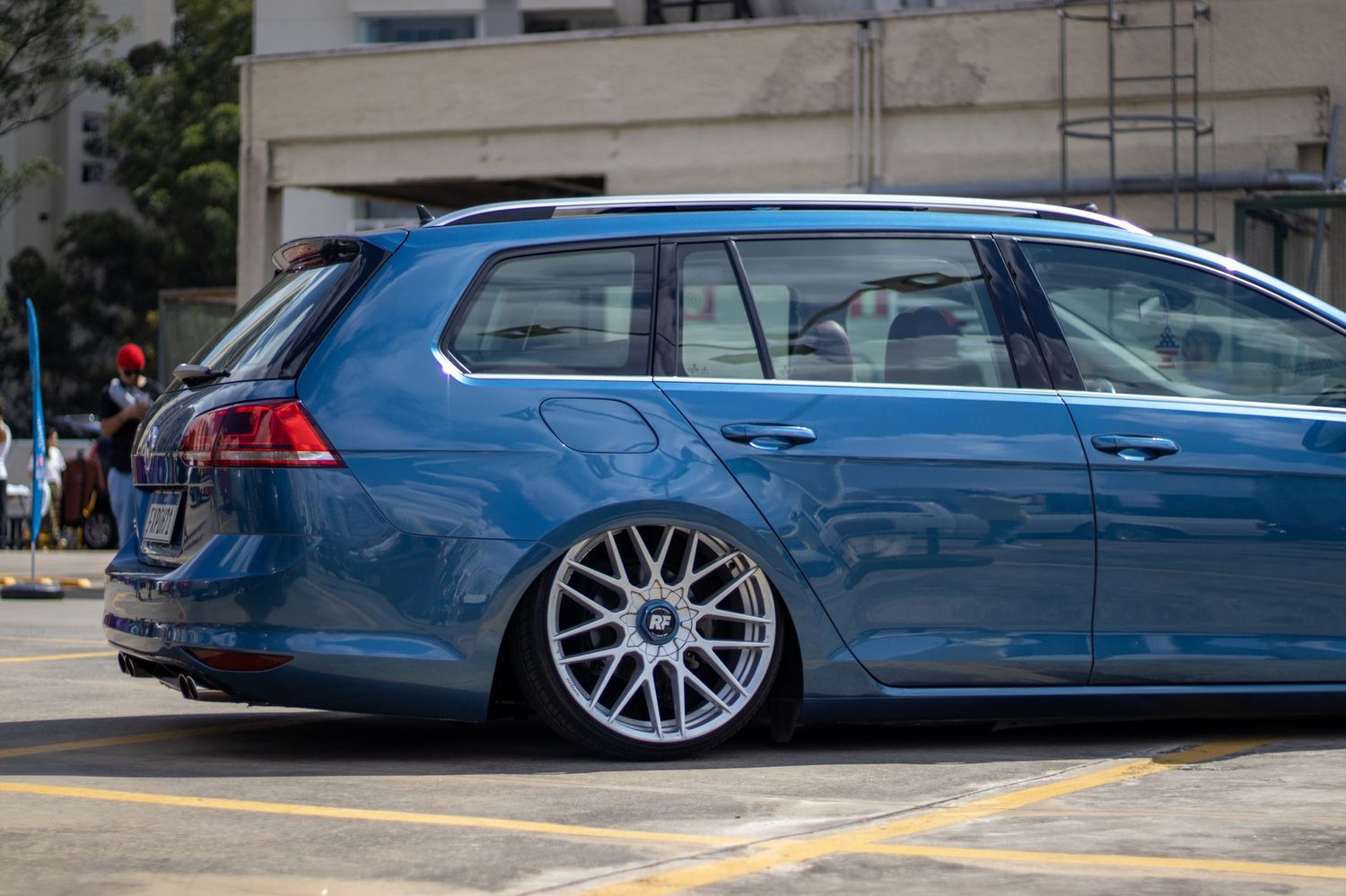A blue estate car showing the roof carried straight back to a vertical tailgate.