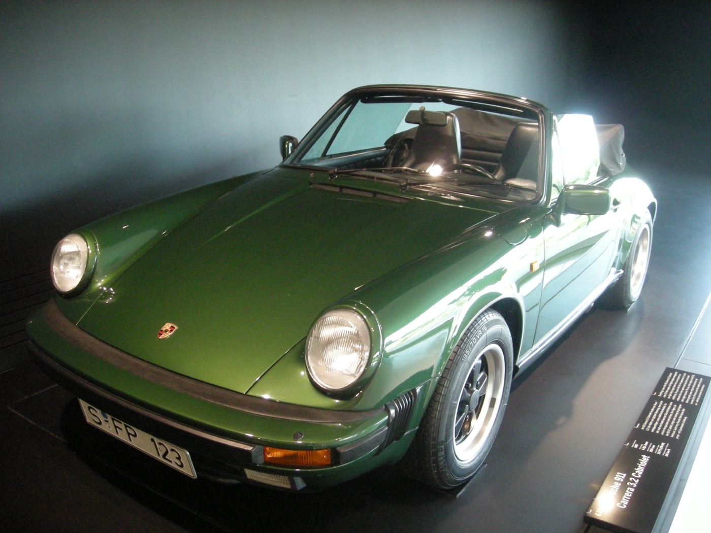 A 1985 Porsche 911 Carrera 3.2 Cabriolet at the Porsche Museum, real photograph.