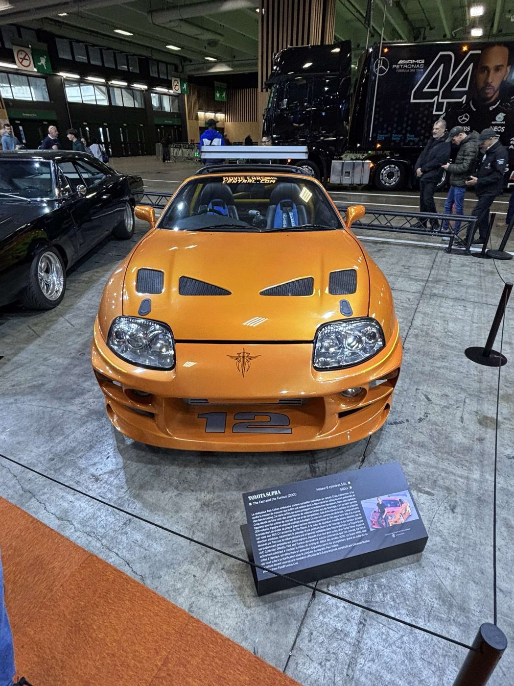 A Toyota Supra MK4 at the Paris Motor Show, real photograph.