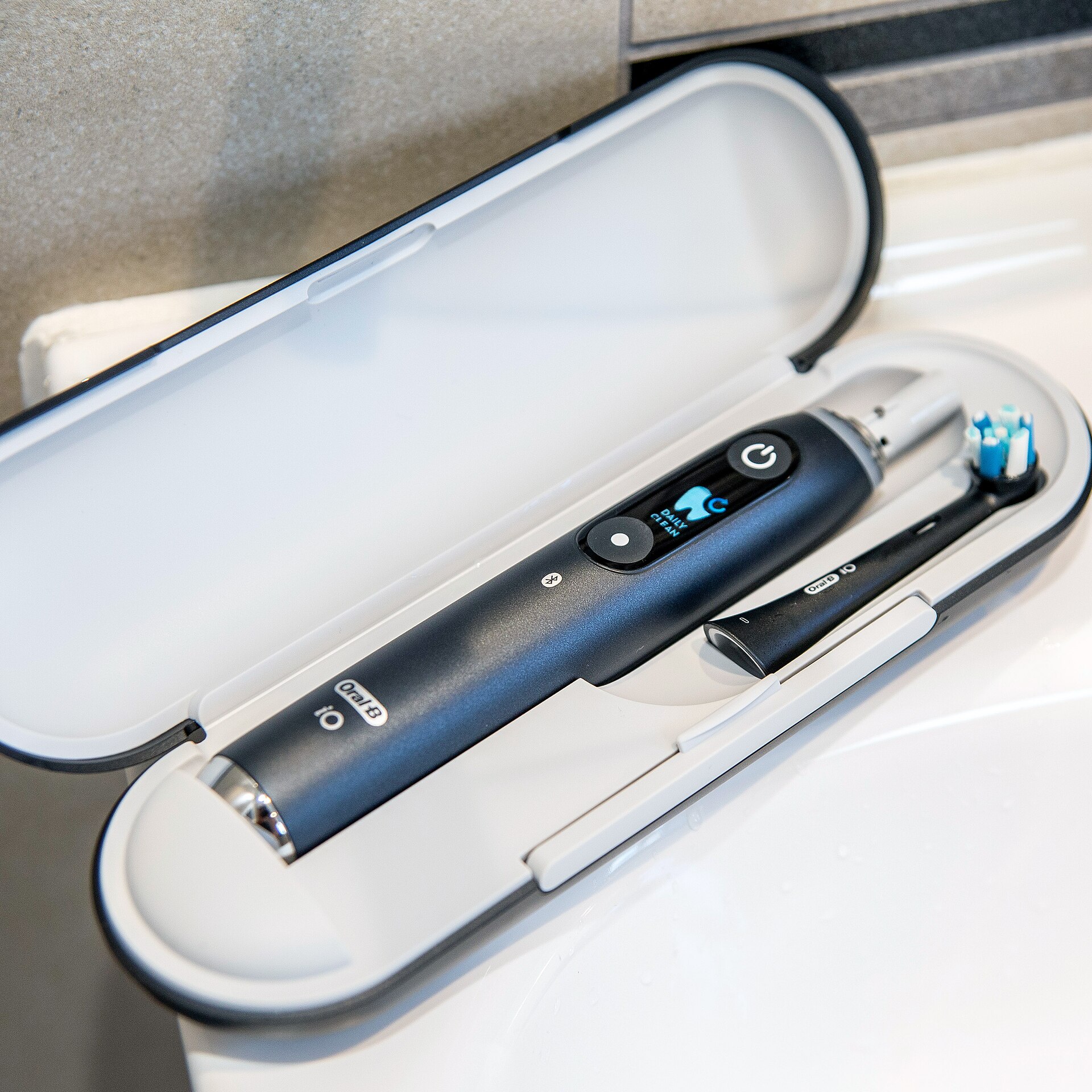 Oral-B iO Series 9 electric toothbrush, real photograph.