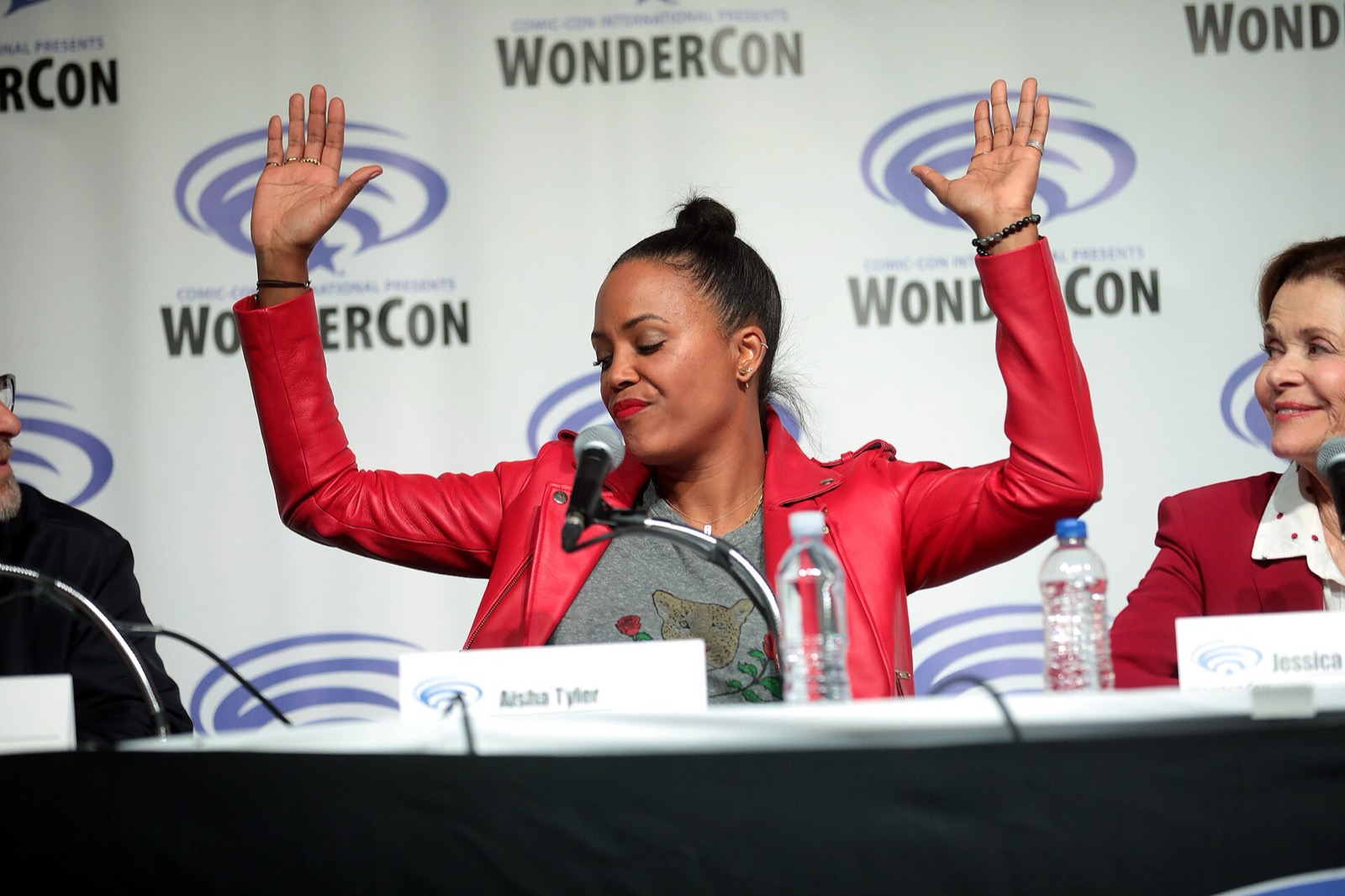 Aisha Tyler in a red leather jacket at WonderCon 2019, third photo