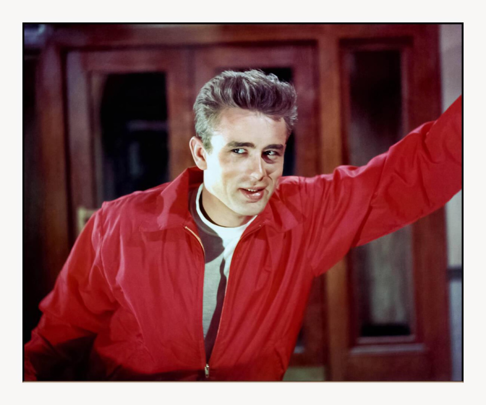 James Dean wearing the red windbreaker from Rebel Without a Cause in a 1955 Warner Bros. publicity photo