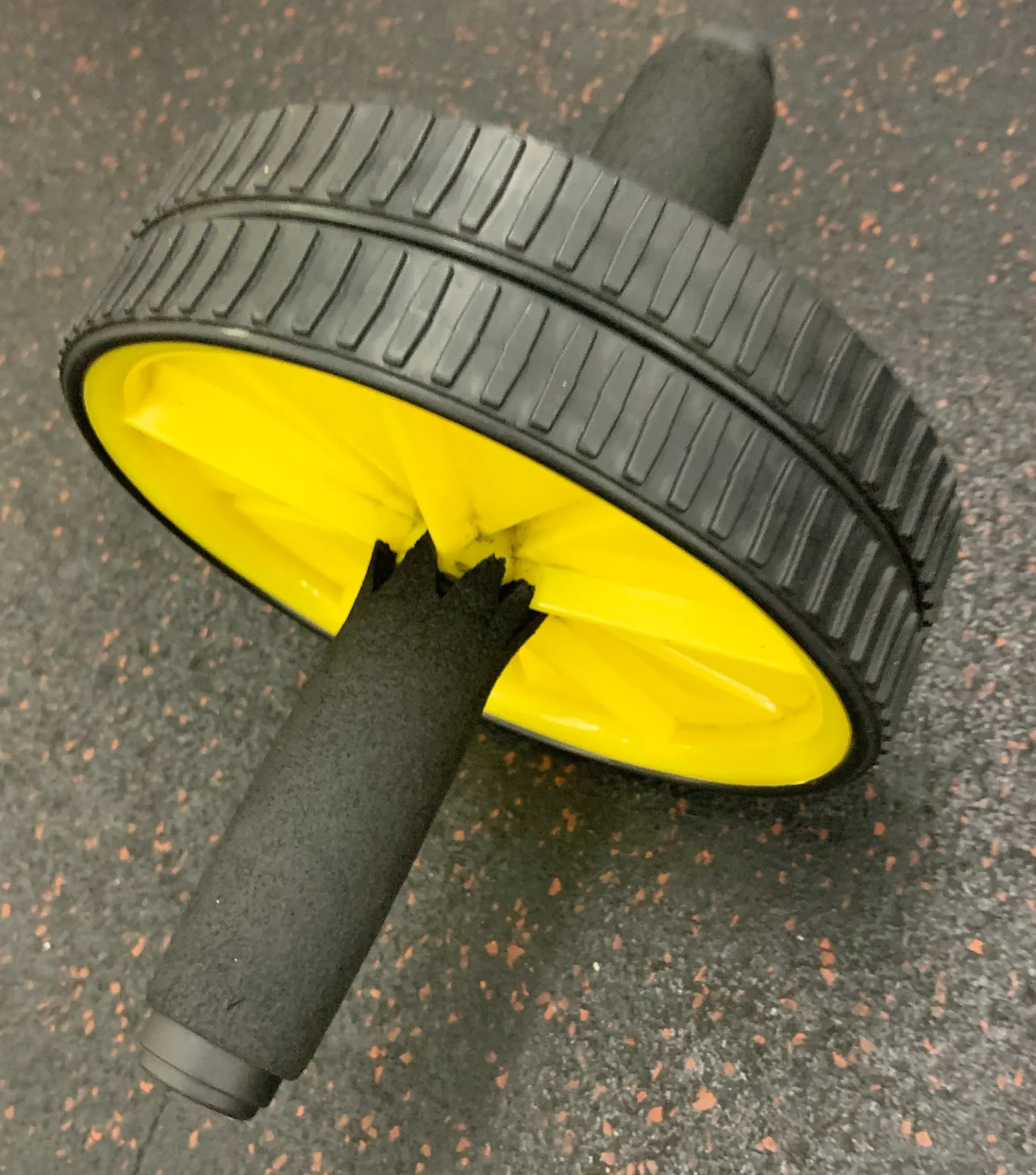 A compact ab roller with two handles.