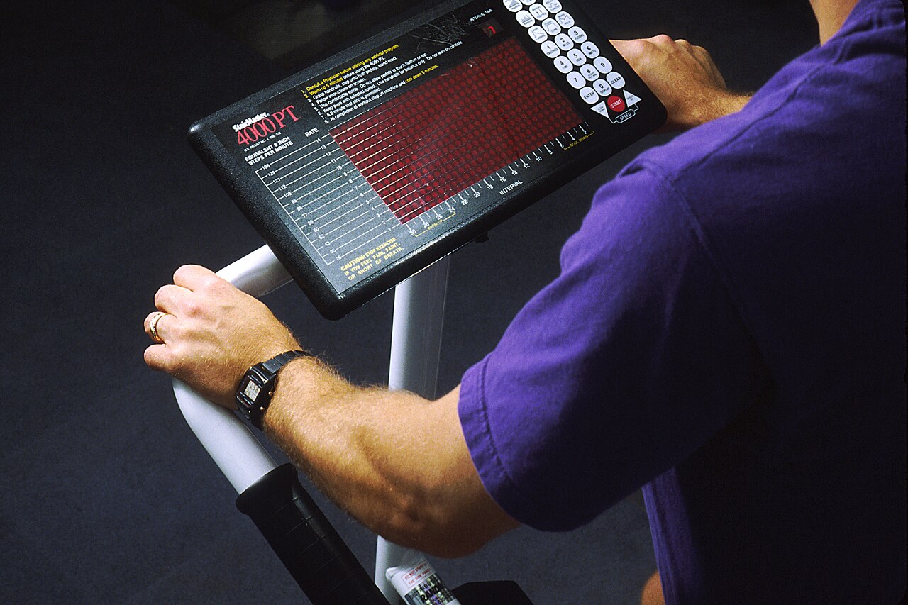 A man exercising on a stair machine in 1992.