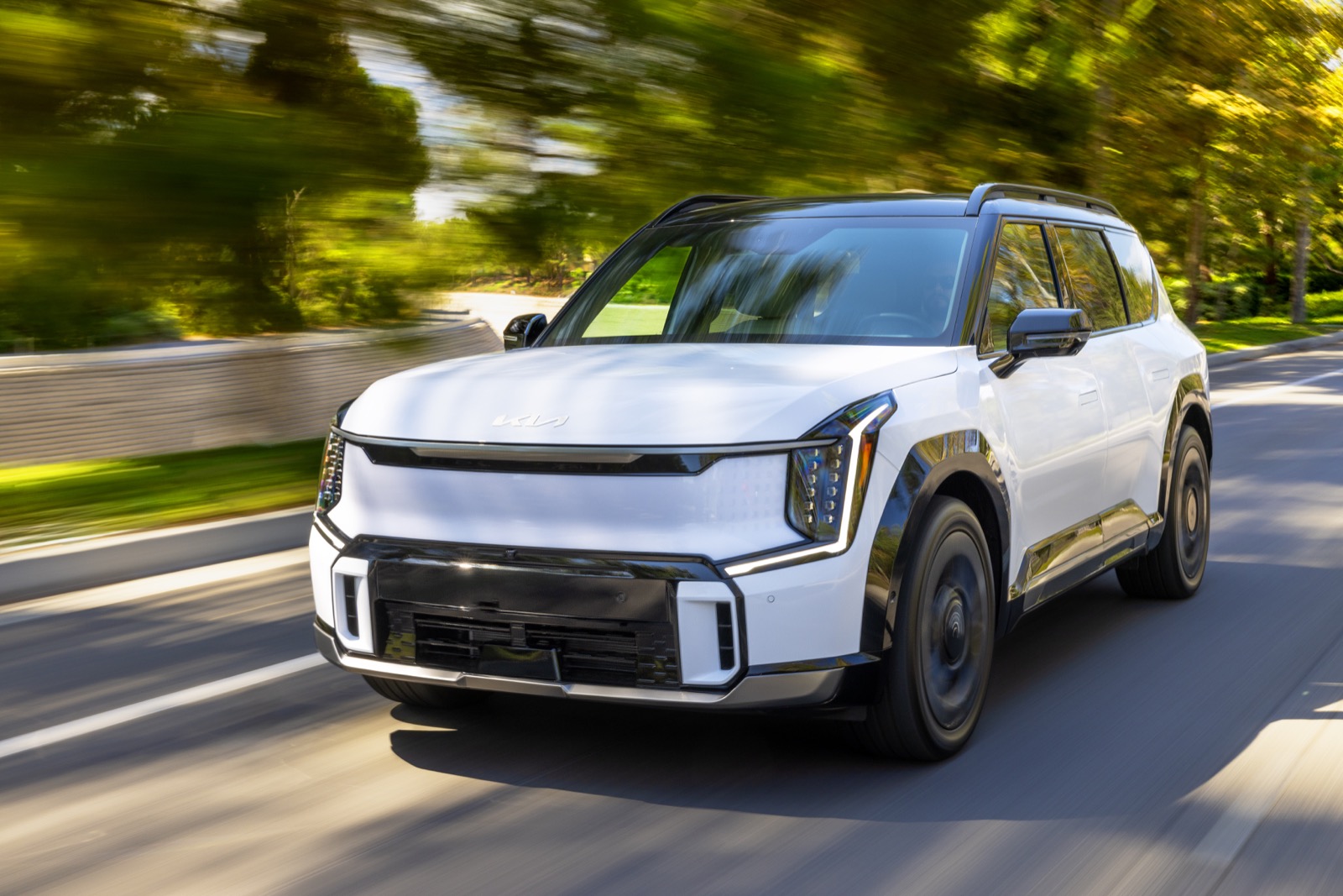 2026 Kia EV9 driving, motion blur background