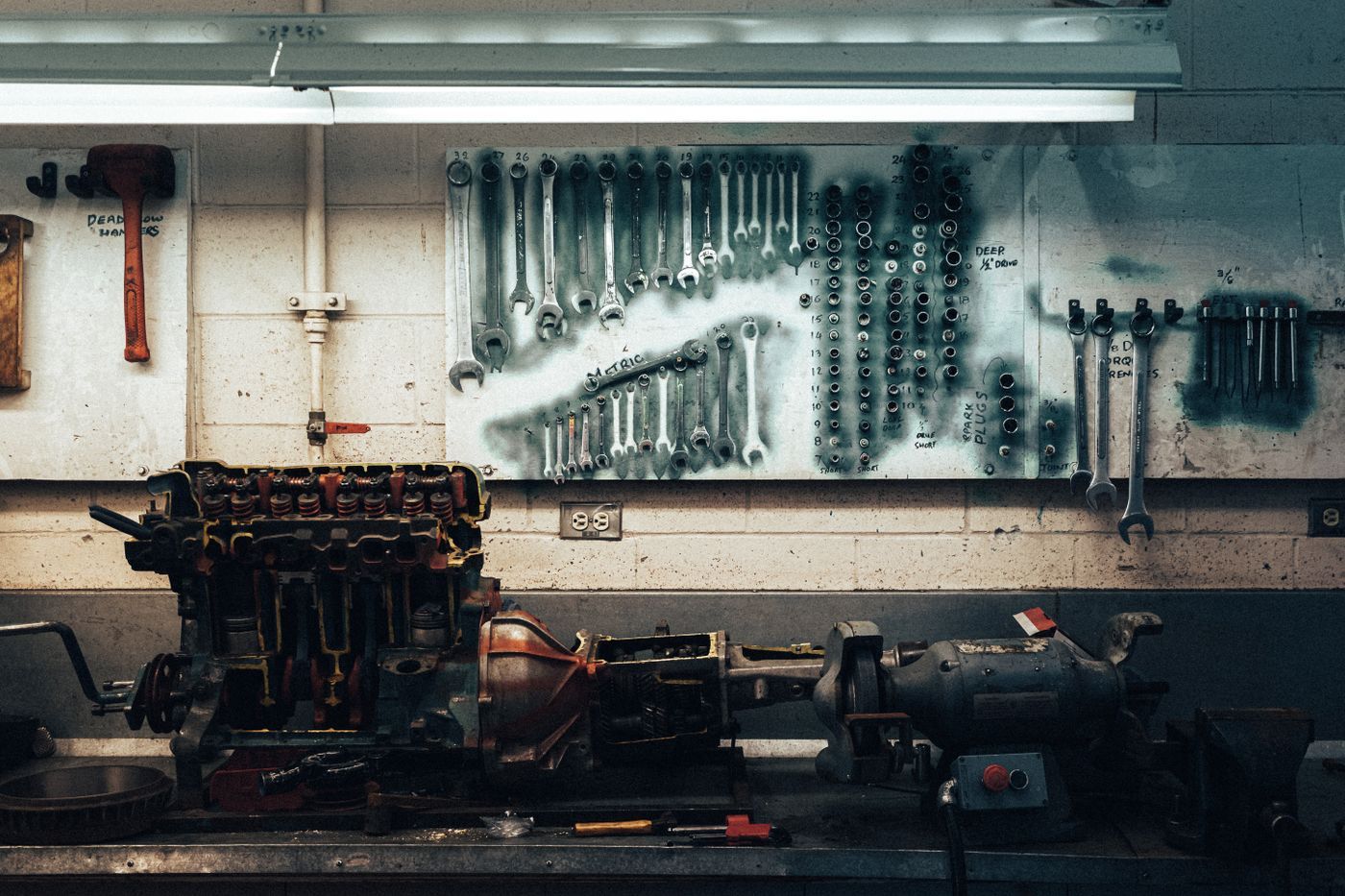 Wrenches on a pegboard wall in a workshop
