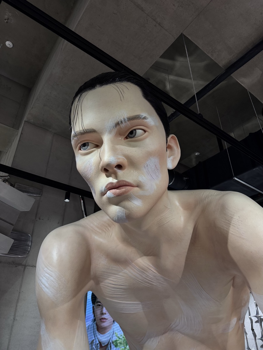 A hyperrealistic figure sculpture on Gentle Monster's second floor.
