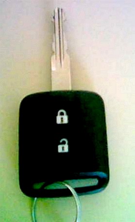An electronic car key that also functions as a remote keyless entry transmitter, real photograph.