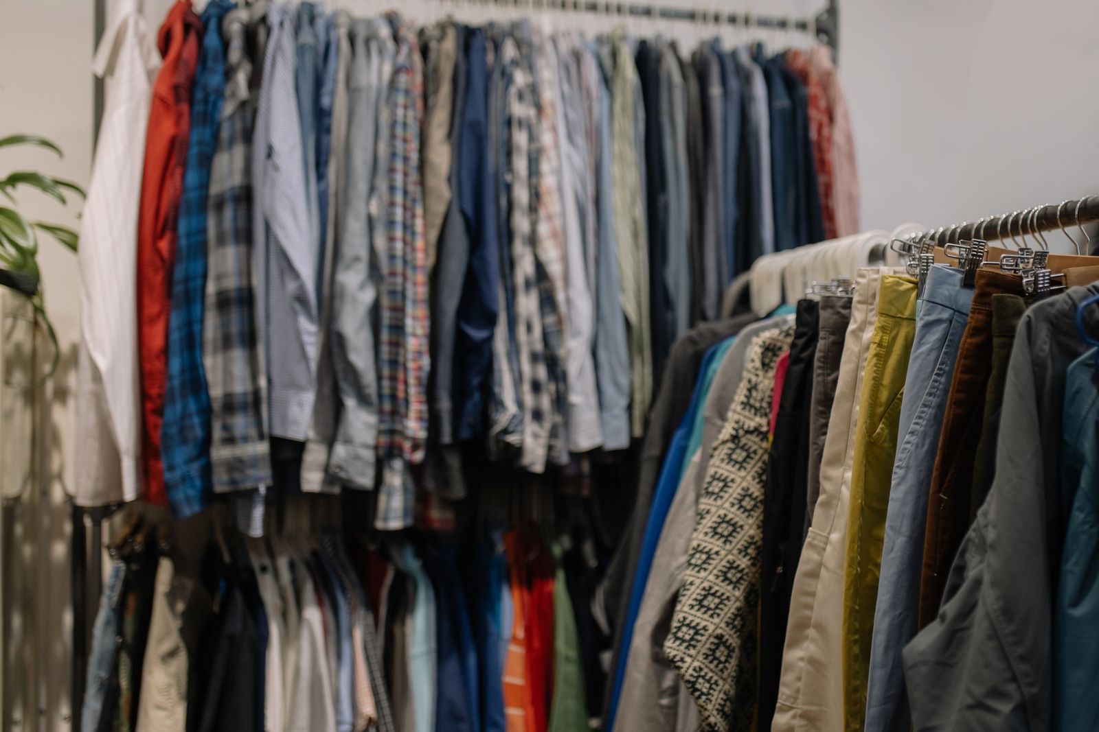Racks of secondhand clothing in a thrift shop, the starting point for a homemade Halloween costume.