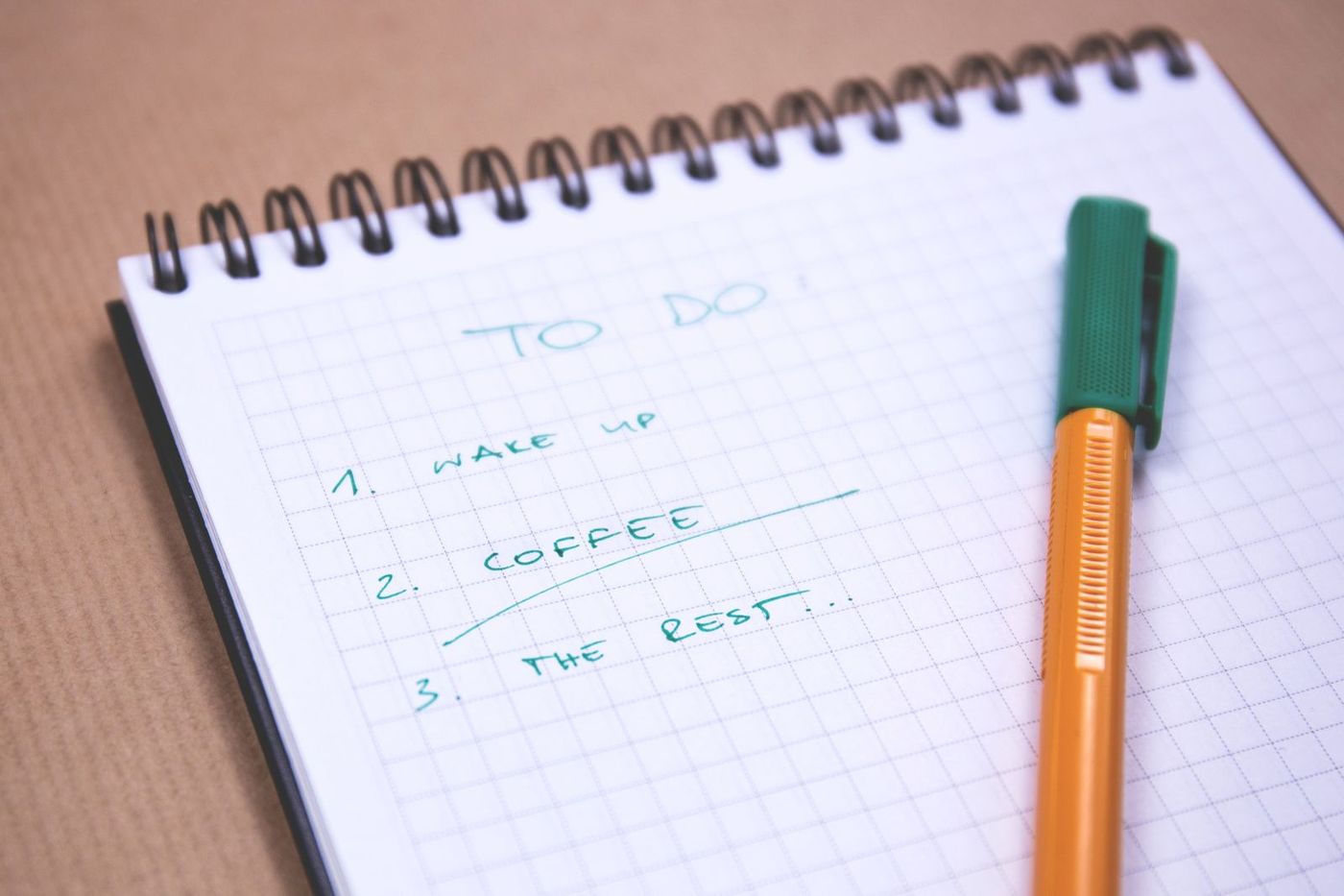 Notebook with a handwritten to-do list and a pen