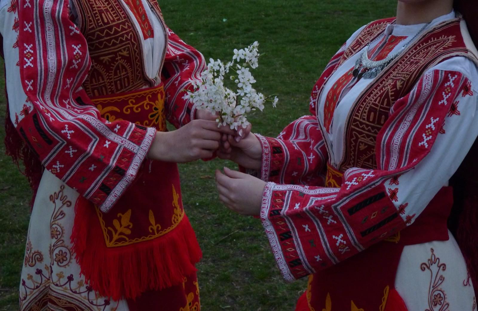 Women in traditional Bulgarian folk costume, a real photograph, referencing the folk-textile tradition Chopova Lowena draws from.
