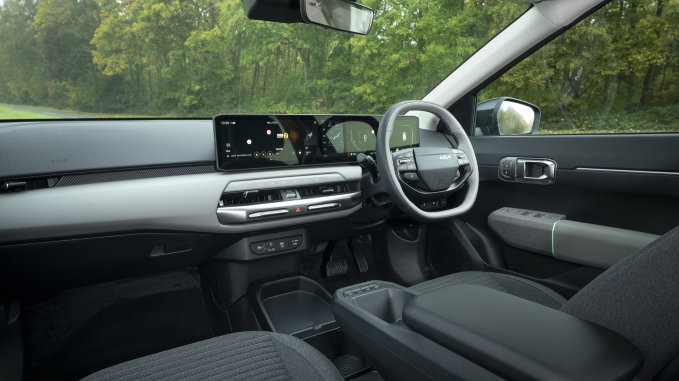Kia EV4 interior, dashboard and steering wheel, official Kia press photography, road test.