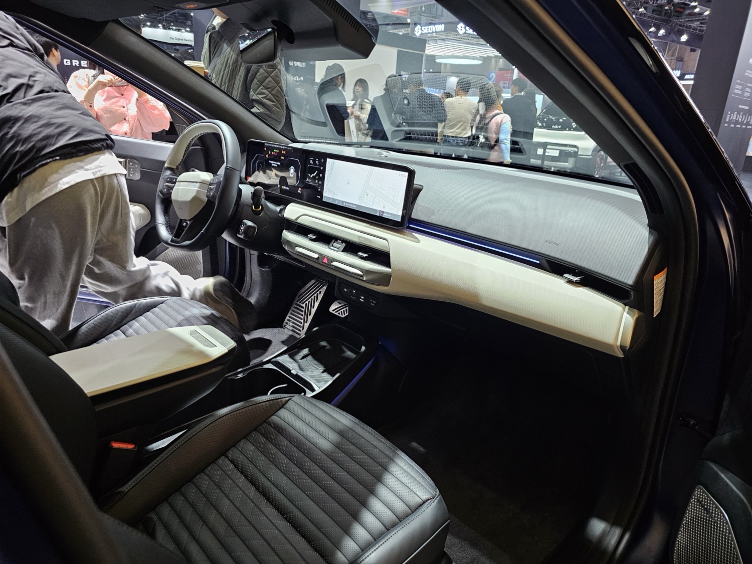 Interior of the Kia EV4 GT-Line with dual panoramic displays.