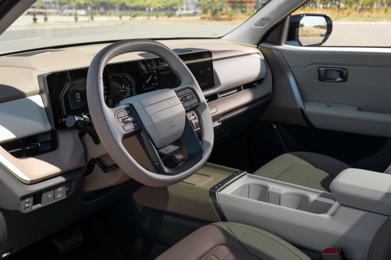 2027 Kia Seltos front cabin and open center console, official Kia press photography.